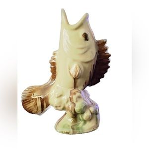 Ceramic fish jumping